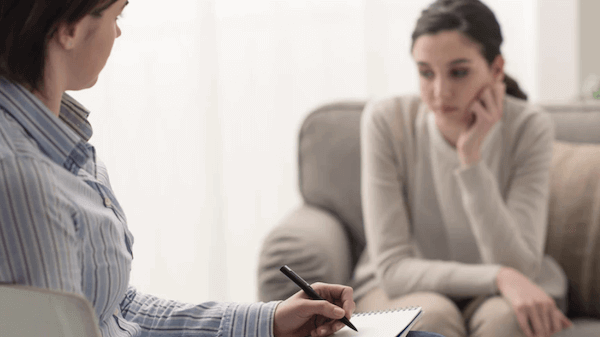 Women consulting a therapist about their marriage