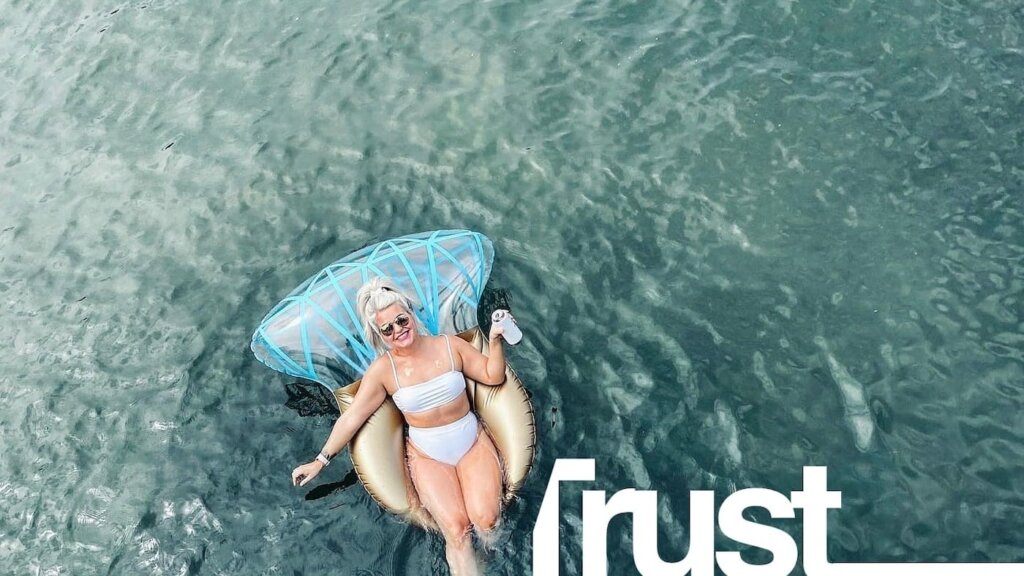 Woman on a inflatable in the ocean.